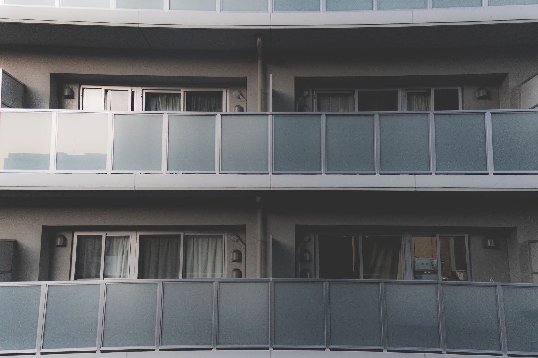Condo building exterior with balconies and modern architecture